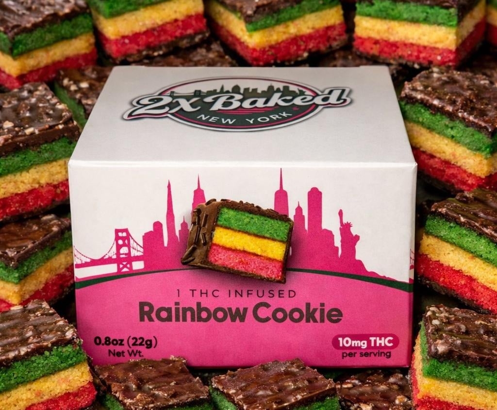 Freshly baked rainbow cookie from 2X Baked, showcasing colorful layers and handcrafted dessert artistry inspired by New York bakery culture.